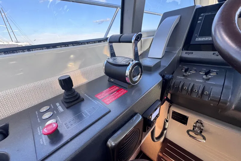  Yacht Photos Pics Control panel of a 2006 Azimut 68S yacht, featuring throttle and joystick controls.