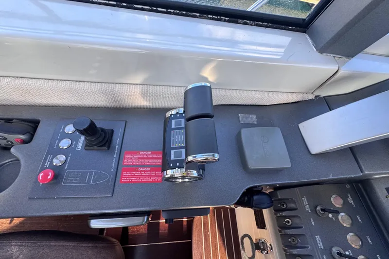  Yacht Photos Pics Control panel of a 2006 Azimut 68S yacht, featuring throttle and joystick controls.