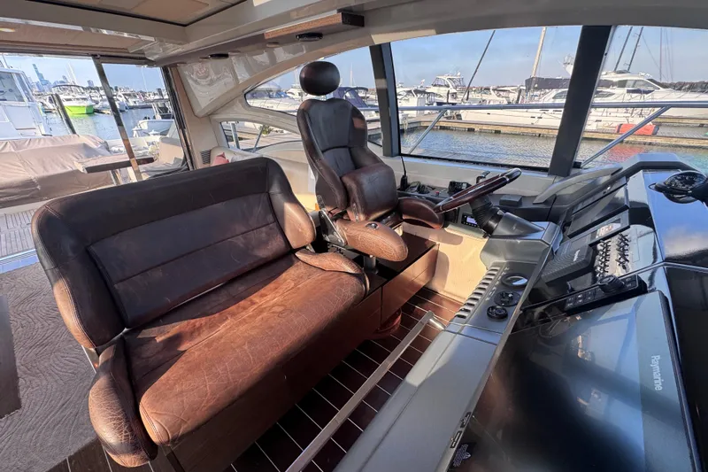  Yacht Photos Pics Interior of 2006 Azimut 68S yacht with leather seating and modern controls.