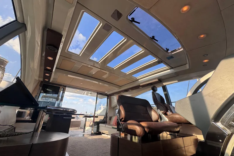  Yacht Photos Pics Luxurious interior of 2006 Azimut 68S yacht with panoramic sunroof and elegant seating.