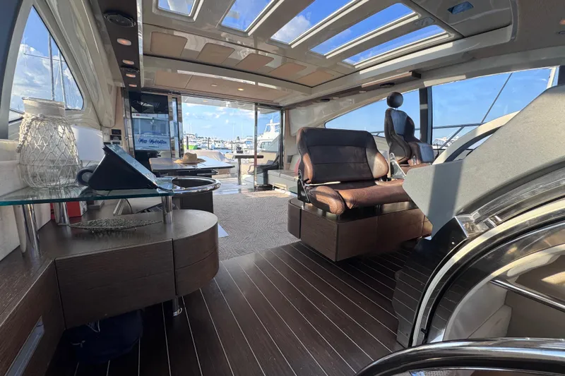  Yacht Photos Pics Luxurious interior of 2006 Azimut 68S yacht with modern seating and panoramic windows.