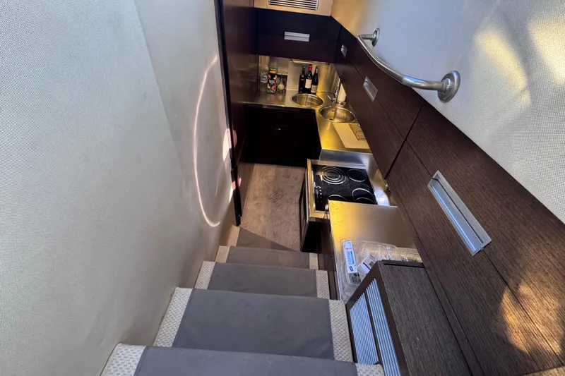  Yacht Photos Pics Interior view of 2006 Azimut 68S yacht kitchen with modern appliances and sleek design.