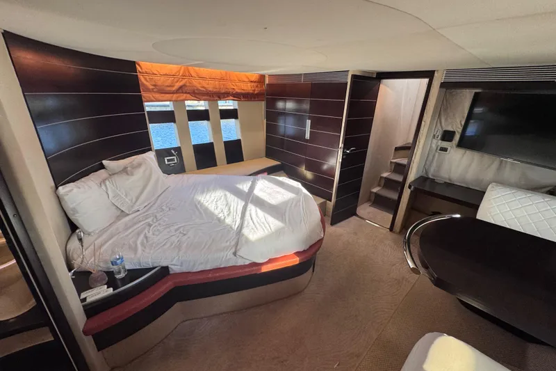  Yacht Photos Pics Luxurious interior of 2006 Azimut 68S yacht with modern bedroom and elegant furnishings.