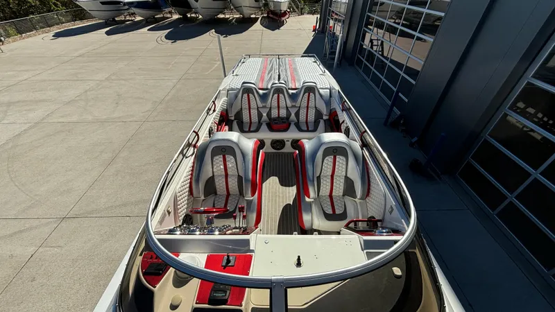  Yacht Photos Pics 2008 Fountain 47 Lightning boat with sleek seating and modern design in a marina setting.