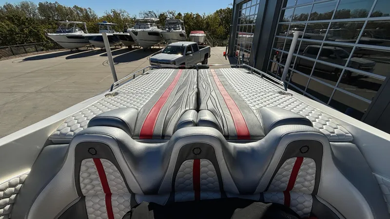  Yacht Photos Pics 2008 Fountain 47 Lightning boat interior with sleek, modern seating and red accents.