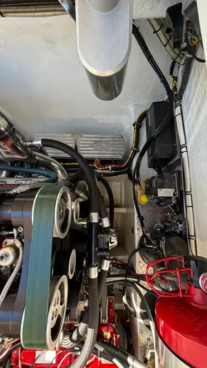  Yacht Photos Pics Engine compartment of a 2008 Fountain 47 Lightning boat, showcasing mechanical components and wiring.