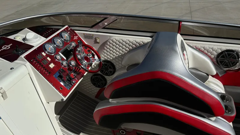  Yacht Photos Pics Interior of 2008 Fountain 47 Lightning boat with red and black dashboard and seating.