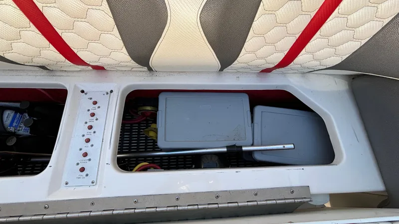  Yacht Photos Pics Interior view of a 2008 Fountain 47 Lightning boat showing storage compartments and seating.