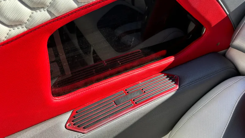  Yacht Photos Pics Interior detail of a 2008 Fountain 47 Lightning boat, featuring red and gray upholstery.
