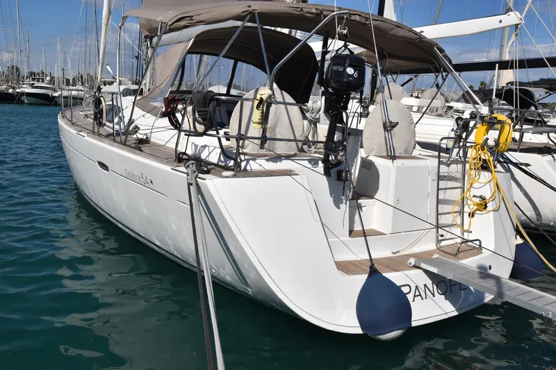 Panope Yacht Photos Pics 2009 Beneteau Oceanis 54 yacht docked in marina, featuring sleek design and modern amenities.