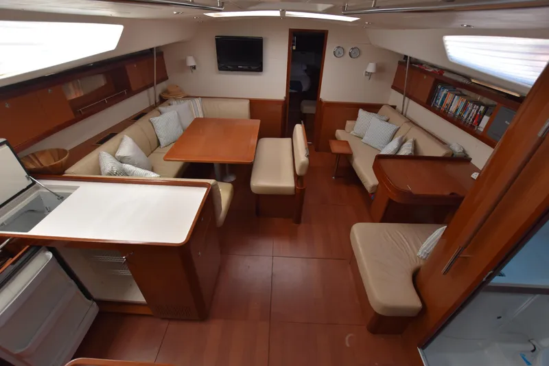 Panope Yacht Photos Pics Luxurious interior of 2009 Beneteau Oceanis 54 yacht with elegant seating and dining area.