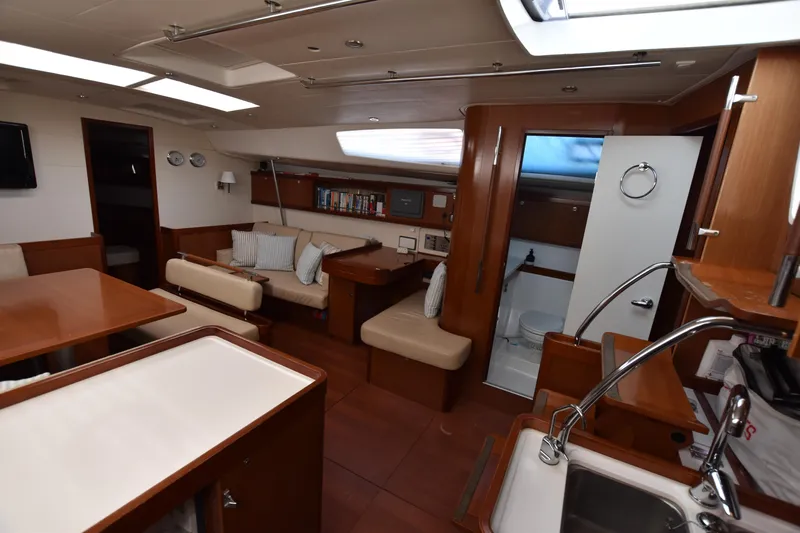 Panope Yacht Photos Pics Luxurious interior of 2009 Beneteau Oceanis 54 yacht with modern amenities and cozy seating.