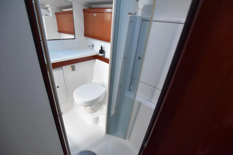 Panope Yacht Photos Pics Luxurious bathroom in 2009 Beneteau Oceanis 54 yacht with modern fixtures.
