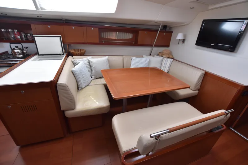 Panope Yacht Photos Pics Luxurious interior of 2009 Beneteau Oceanis 54 yacht with cozy seating and modern amenities.