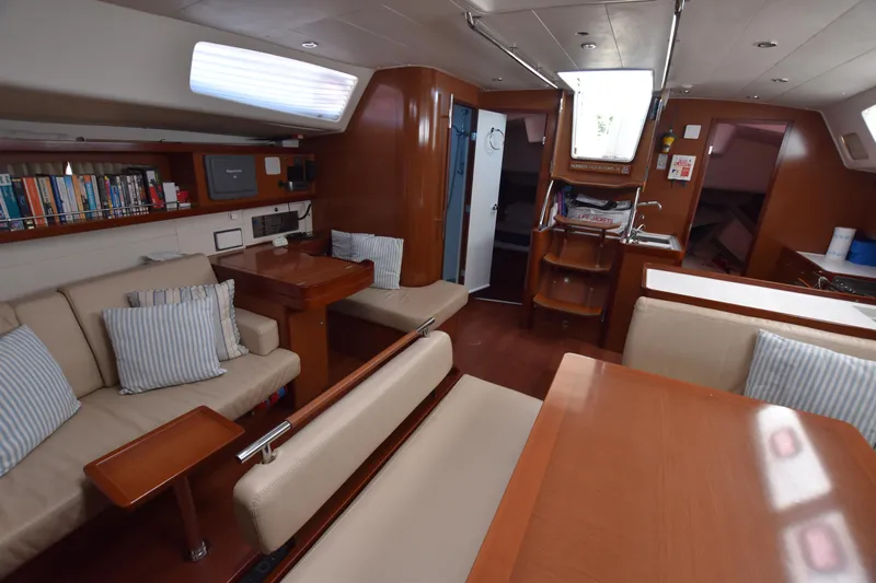 Panope Yacht Photos Pics Interior of 2009 Beneteau Oceanis 54 yacht with cozy seating and modern amenities.