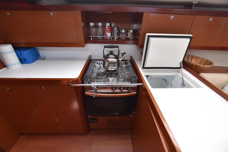 Panope Yacht Photos Pics Galley kitchen in 2009 Beneteau Oceanis 54 yacht with stove and storage.