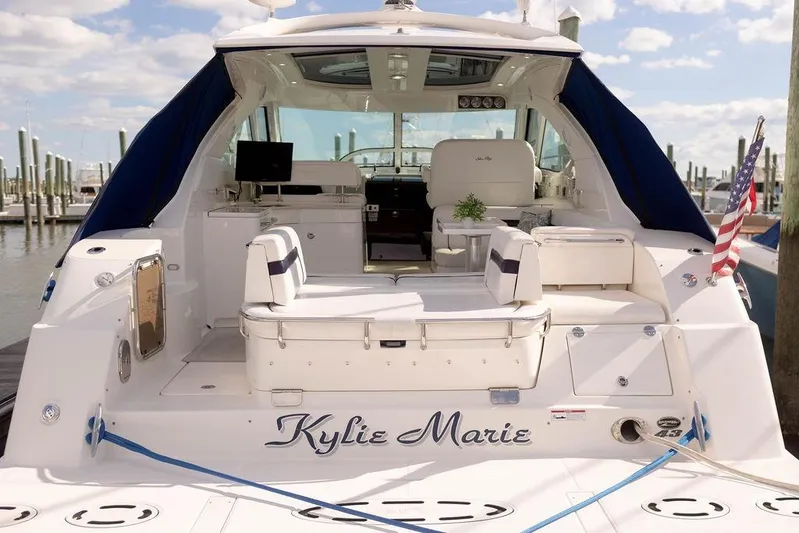 Kylie Marie Yacht Photos Pics 2009 Searay 43 Sundancer yacht docked, featuring spacious seating and elegant design.