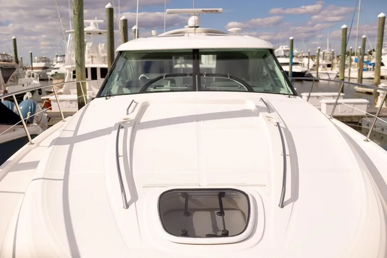 Kylie Marie Yacht Photos Pics 2009 Searay 43 Sundancer yacht docked at marina under blue sky.