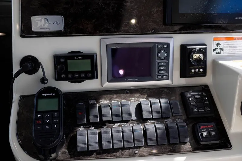 Kylie Marie Yacht Photos Pics Control panel of a 2009 Searay 43 Sundancer boat with navigation and communication devices.