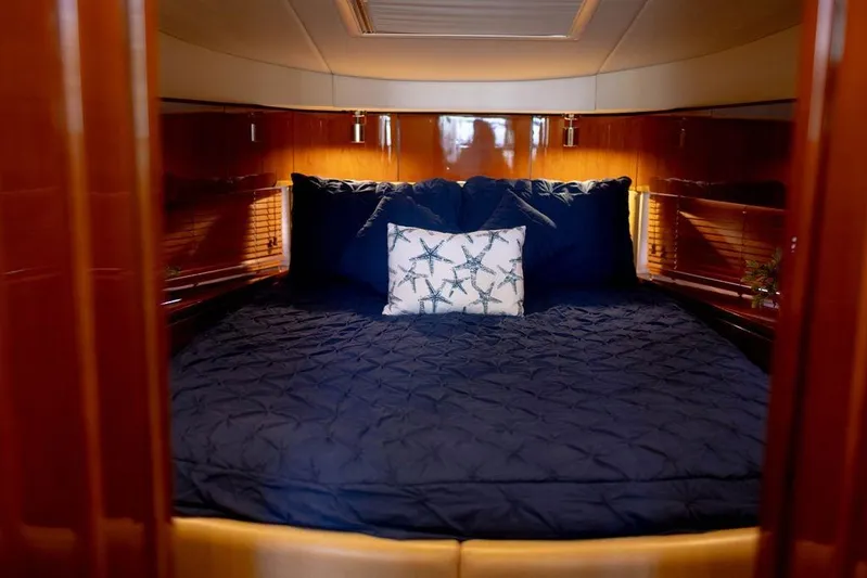 Kylie Marie Yacht Photos Pics Luxurious cabin interior of 2009 Searay 43 Sundancer yacht with plush bedding.