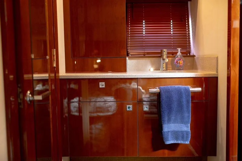 Kylie Marie Yacht Photos Pics Luxurious bathroom interior of 2009 Searay 43 Sundancer yacht with wooden cabinetry.
