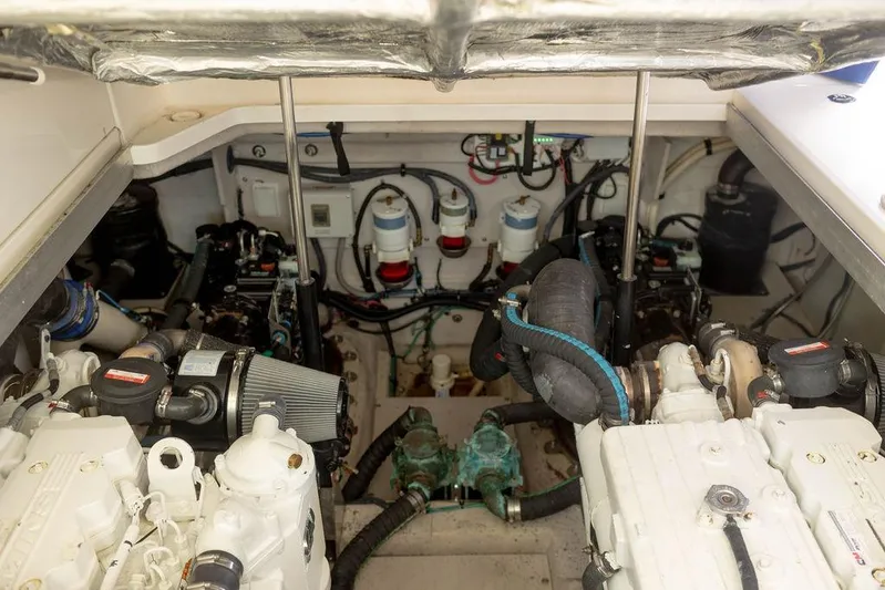 Kylie Marie Yacht Photos Pics Engine room of 2009 Searay 43 Sundancer, showcasing dual engines and mechanical components.