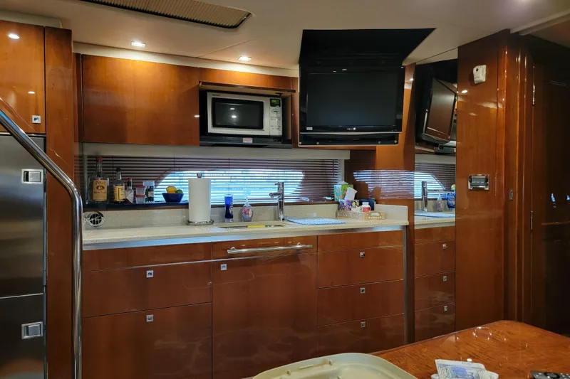 Kylie Marie Yacht Photos Pics Luxurious 2009 Searay 43 Sundancer yacht interior with modern kitchen amenities.