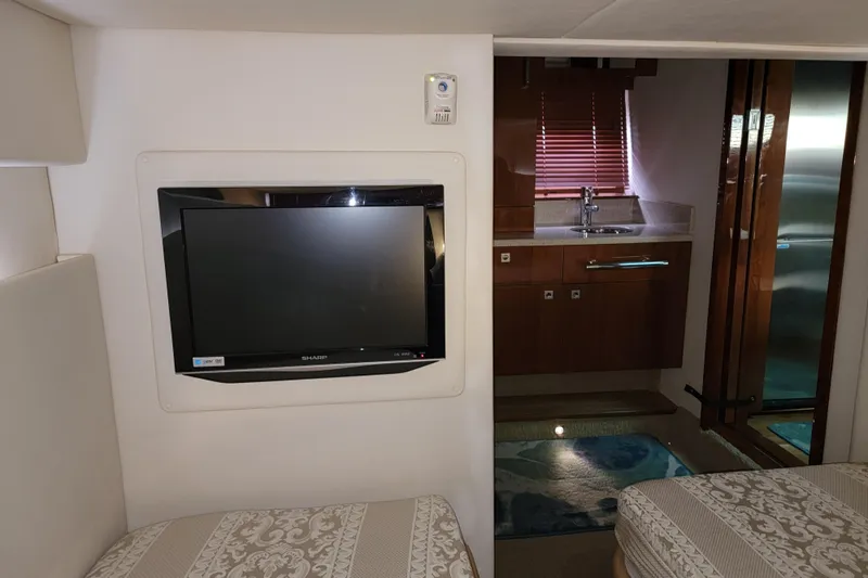 Kylie Marie Yacht Photos Pics Interior of 2009 Searay 43 Sundancer yacht with TV and kitchenette.
