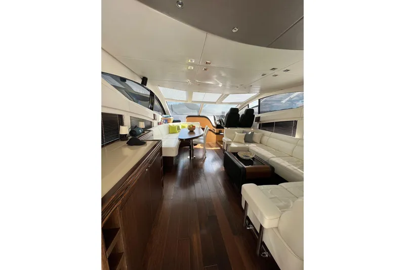 Escape Yacht Photos Pics Luxurious interior of 2014 Sunseeker 68 Sport Yacht with elegant seating and modern design.