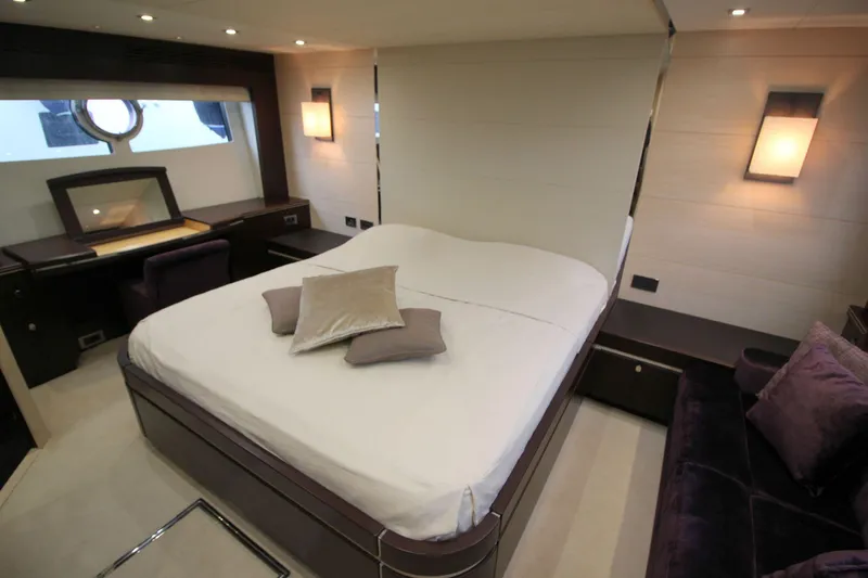 Escape Yacht Photos Pics Luxurious bedroom interior of 2014 Sunseeker 68 Sport Yacht with modern decor.