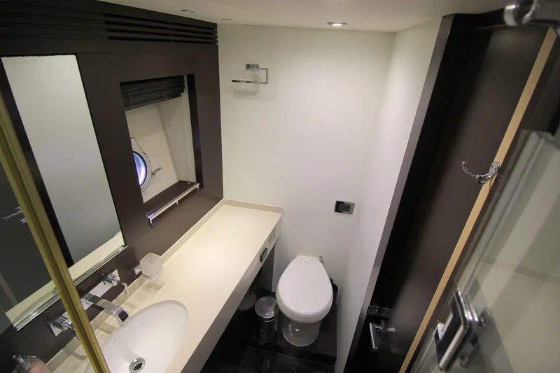 Escape Yacht Photos Pics Luxurious bathroom in 2014 Sunseeker 68 Sport Yacht with modern fixtures.