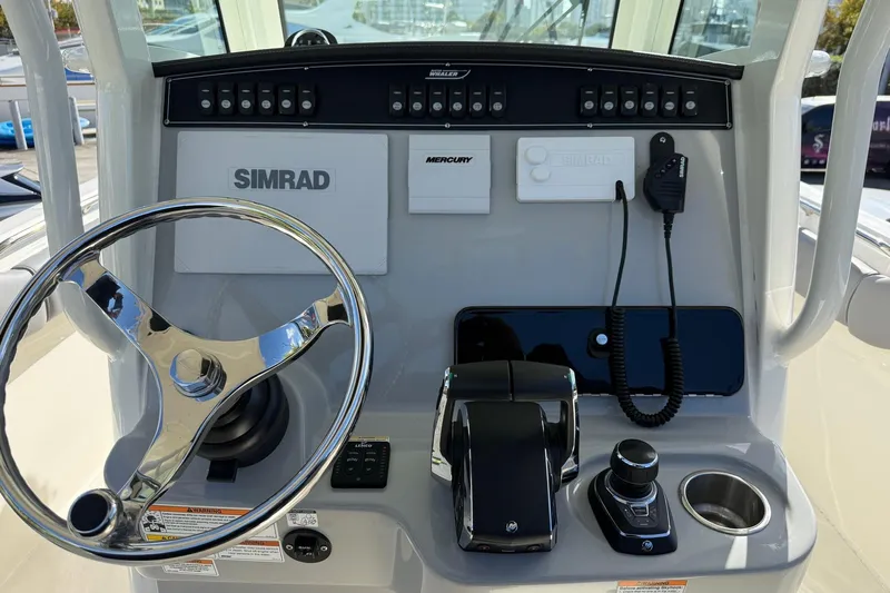  Yacht Photos Pics 2023 Boston Whaler 280 Outrage helm with Simrad electronics and Mercury controls.