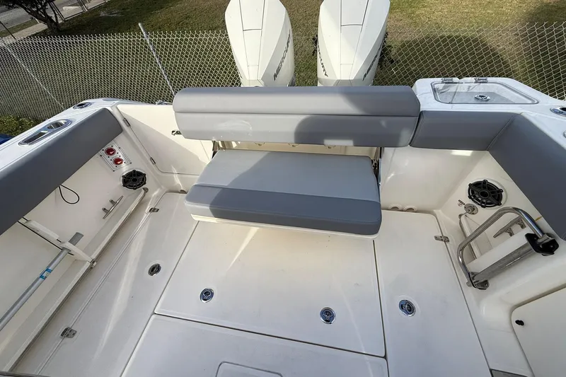 Yacht Photos Pics 2023 Boston Whaler 280 Outrage boat interior with seating and dual engines.
