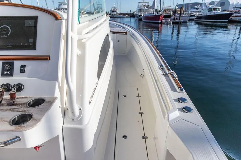 Stargazer Yacht Photos Pics 2024 Hinckley Sport Boat 40c docked, showcasing sleek design and modern controls.