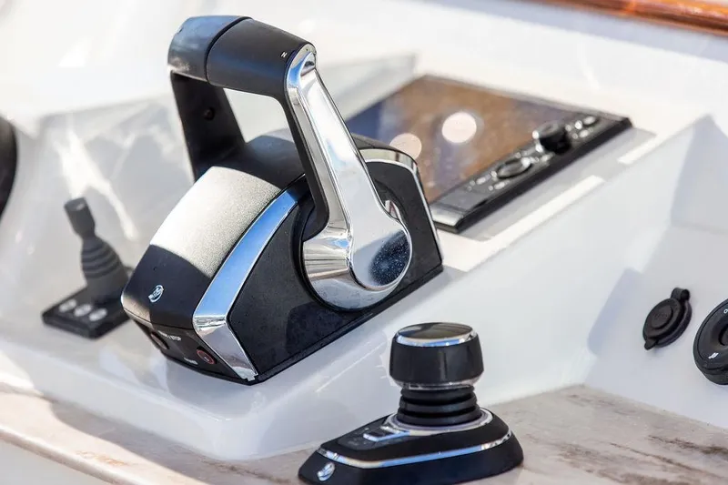 Stargazer Yacht Photos Pics Control panel of 2024 Hinckley Sport Boat 40c, featuring modern throttle and joystick.