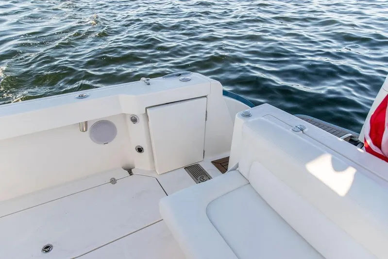 Stargazer Yacht Photos Pics 2024 Hinckley Sport Boat 40c deck with seating, overlooking calm water.