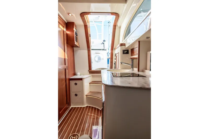 Stargazer Yacht Photos Pics Luxurious interior of 2024 Hinckley Sport Boat 40c with elegant wood finishes.