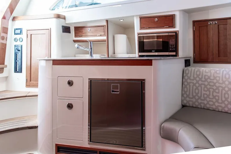 Stargazer Yacht Photos Pics 2024 Hinckley Sport Boat 40c interior with modern kitchen and seating area.