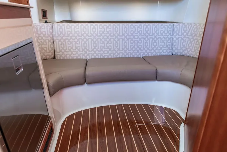 Stargazer Yacht Photos Pics 2024 Hinckley Sport Boat 40c interior with elegant seating and wood flooring.