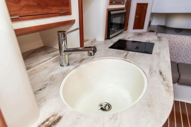 Stargazer Yacht Photos Pics 2024 Hinckley Sport Boat 40c interior with modern sink and countertop.
