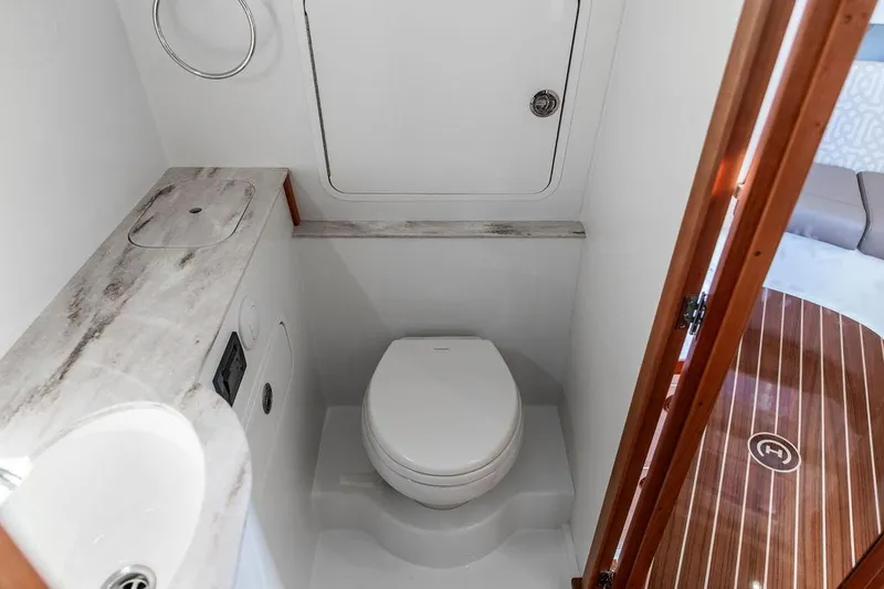 Stargazer Yacht Photos Pics 2024 Hinckley Sport Boat 40c bathroom with modern fixtures and wooden accents.