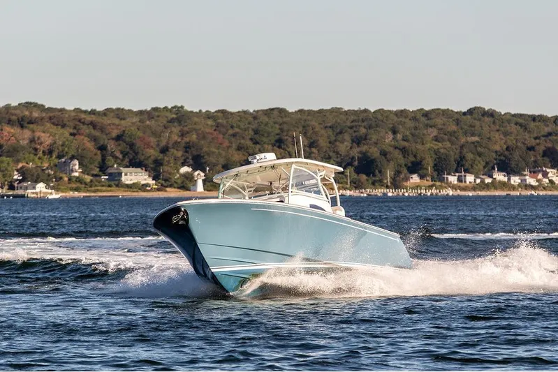 Stargazer Yacht Photos Pics 2024 Hinckley Sport Boat 40c cruising on a scenic waterway.