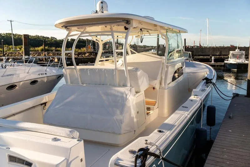 Stargazer Yacht Photos Pics 2024 Hinckley Sport Boat 40c docked at marina, showcasing sleek design and luxury features.