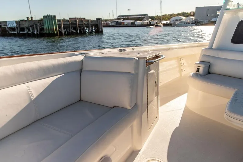 Stargazer Yacht Photos Pics 2024 Hinckley Sport Boat 40c interior with white seating, dockside view.