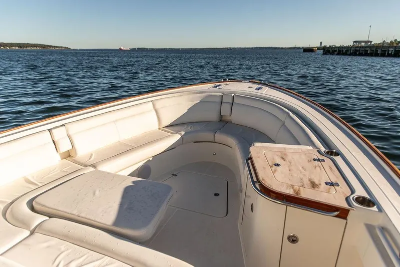 Stargazer Yacht Photos Pics 2024 Hinckley Sport Boat 40c, luxurious seating, docked on calm waters.