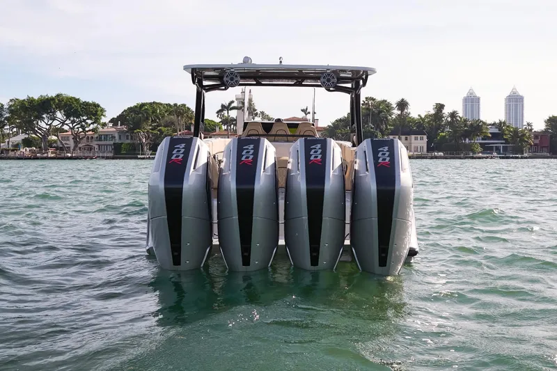  Yacht Photos Pics 2024 Midnight Express 37' Open boat with quad outboard engines on the water.