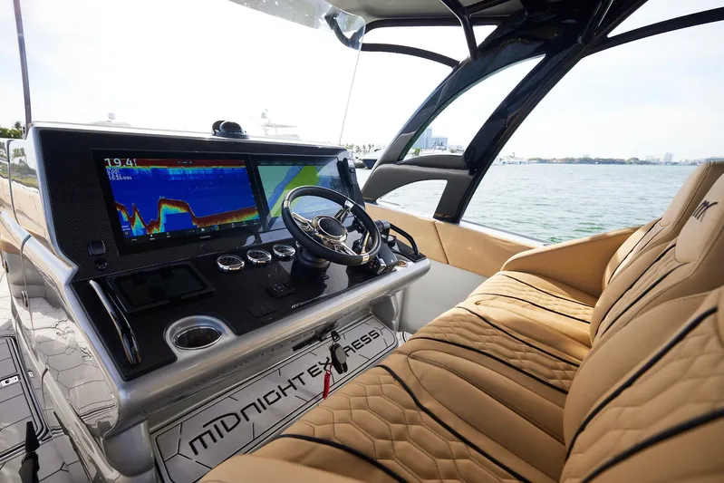  Yacht Photos Pics 2024 Midnight Express 37' Open boat interior with advanced navigation system and luxurious seating.