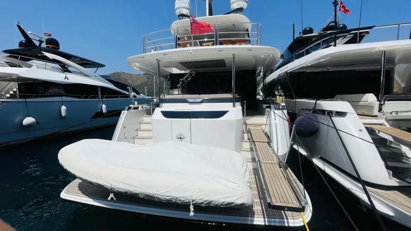  Yacht Photos Pics 2024 Sirena 78 yacht docked, featuring a spacious deck and modern design.