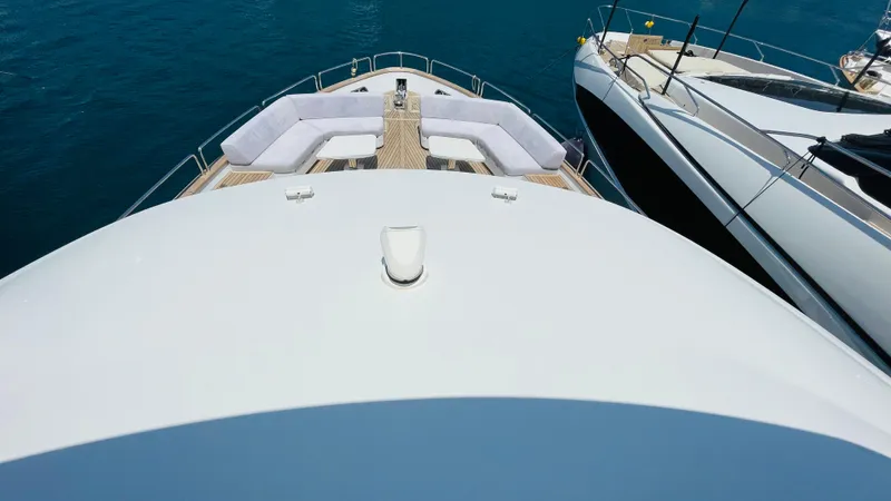  Yacht Photos Pics Luxury Sirena 78 yacht deck with seating, 2024 model, docked beside another yacht.