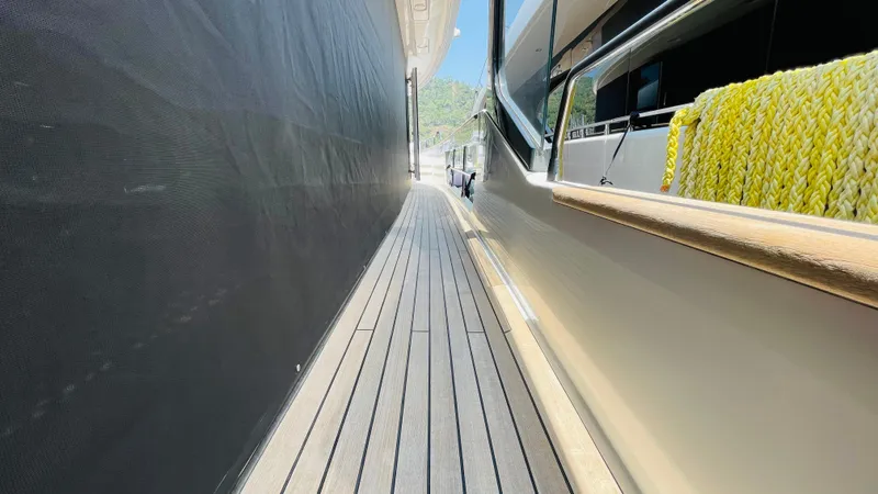 Yacht Photos Pics Side deck of 2024 Sirena 78 yacht with wooden flooring and railing.
